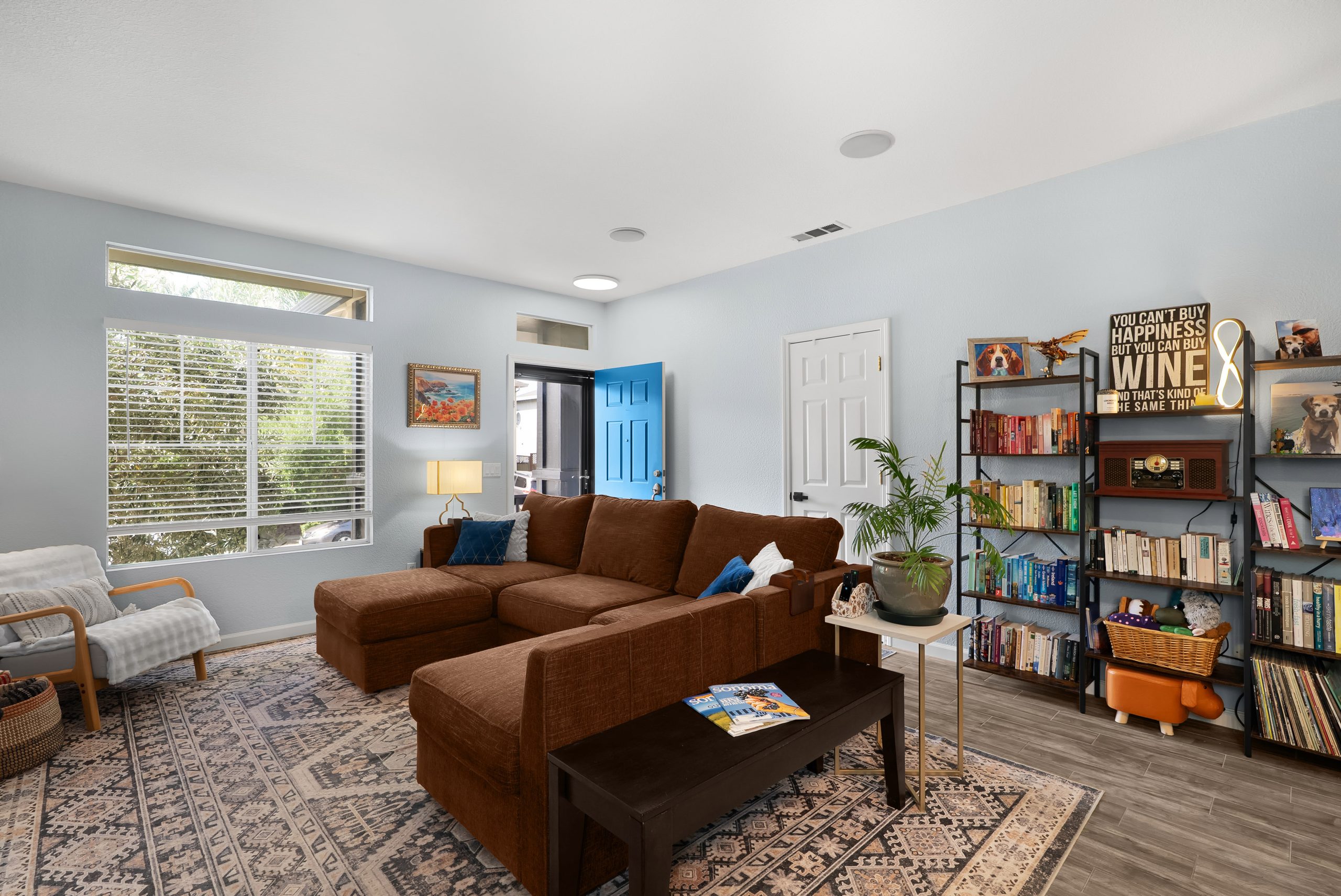 Living room with gas fireplace open to the dining area